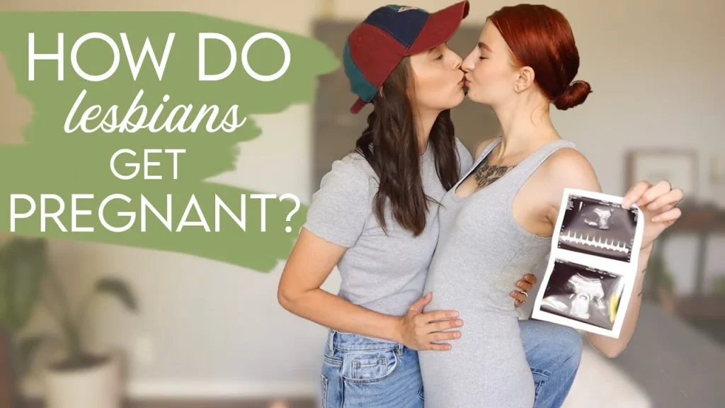 two women kissing, one holding an ultrasound photo, celebrating pregnancy together